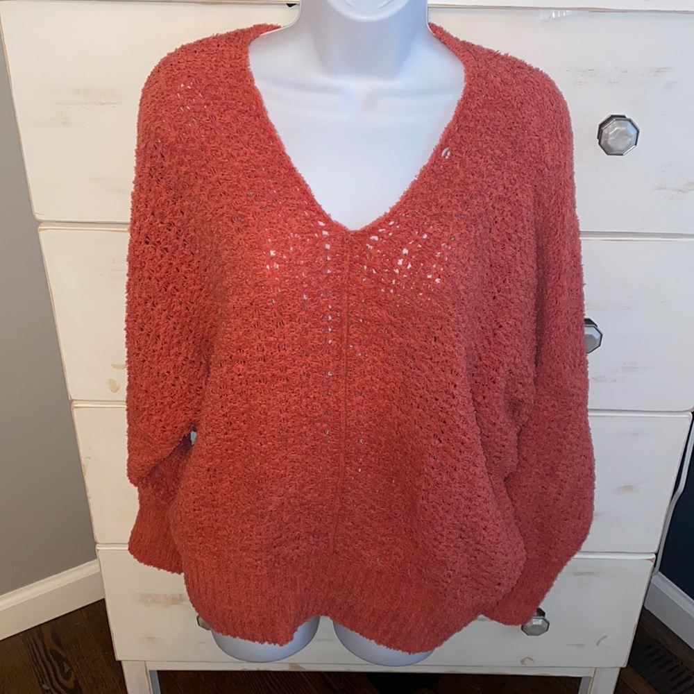 NWOT beautiful coral colored sweater.